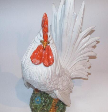 A 20thC Continental pottery group of a standing cockerel of large proportion