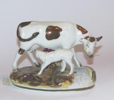 TO GR270716. A 19thC pottery cow and calf group