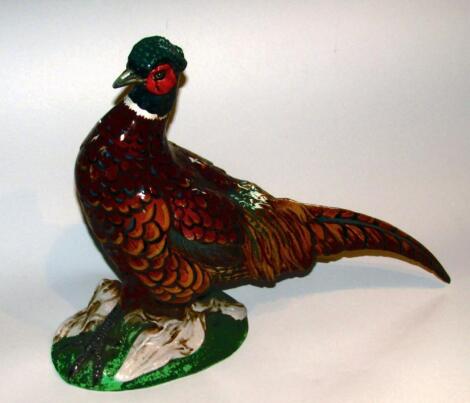 A Continental pottery figure of a standing pheasant