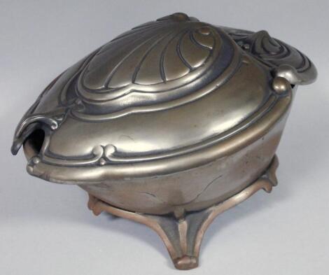 An Art Nouveau design metal coal box