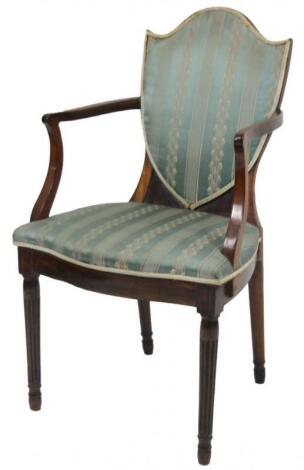 An early 19thC mahogany Hepplewhite style shield back carver chair