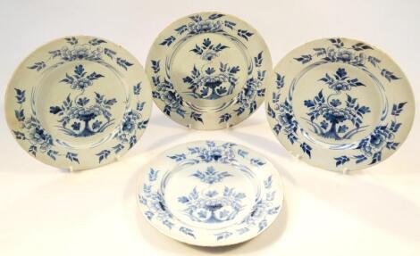 A near matching set of four 18thC English blue and white Delft plates