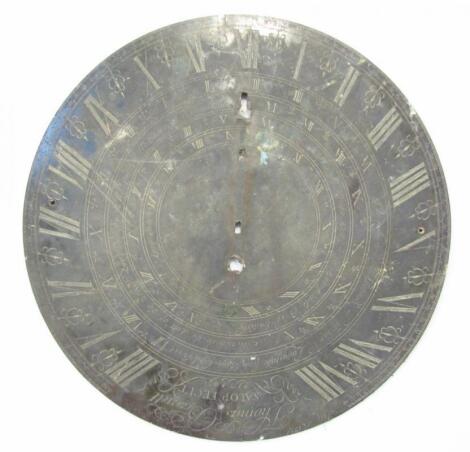 A metal sun dial plate