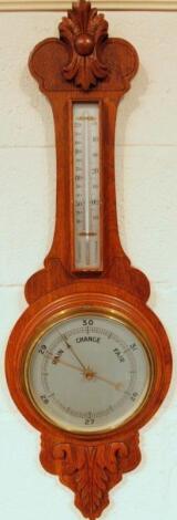 An Edwardian oak cased two dial banjo barometer and thermometer