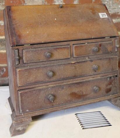 A 19thC tradesman's piece miniature oak bureau