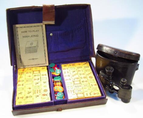 A 20thC leather cased Mah-Jong set