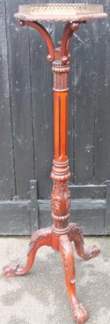 A 20thC mahogany finish torchere