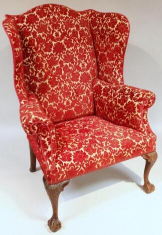 A George III mahogany framed wing armchair