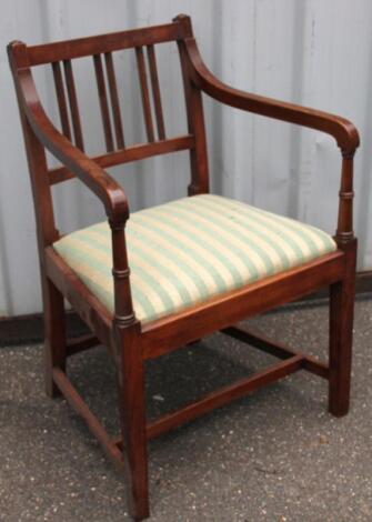 An 18thC elm Sheraton style country carver chair