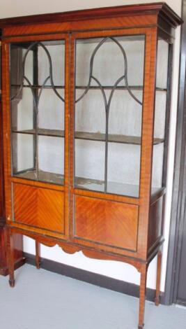 An Edwardian walnut finish display cabinet