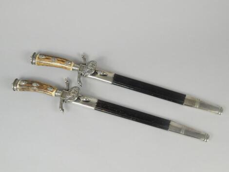 A pair of 19thC German hunting knives or daggers