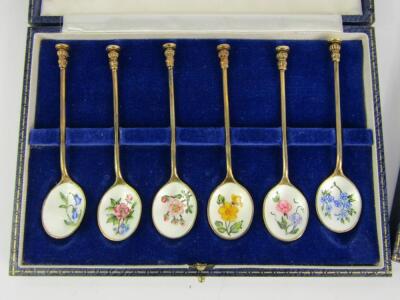 Two sets of silver gilt and enamel seal top teaspoons - 2