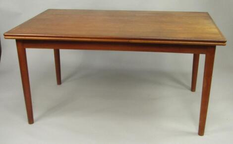 A 1960's teak drawleaf dining table