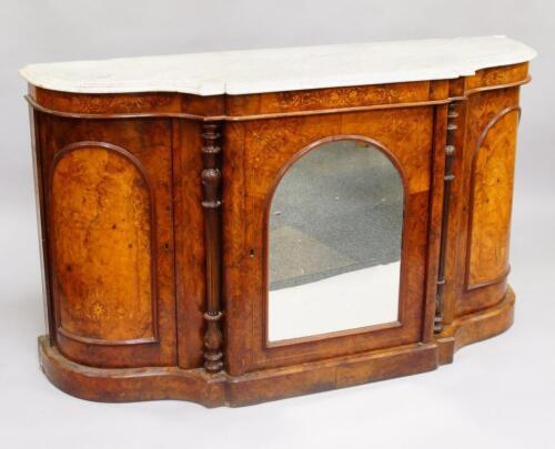 A Victorian walnut and satinwood inlaid serpentine pier cabinet