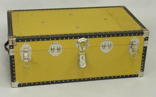 A yellow canvas bound cabin trunk