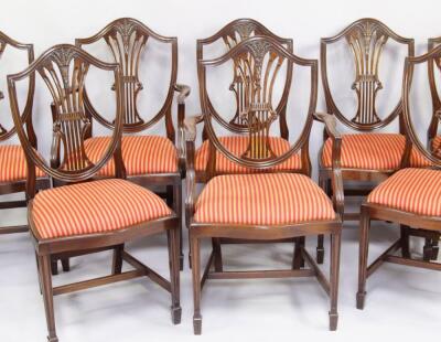 A set of eight Hepplewhite style mahogany shield back dining chairs