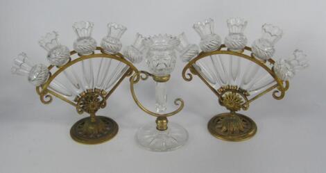 A pair of Victorian cut glass and brass quintel vases