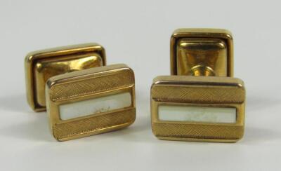 A pair of Murrat textured yellow metal and mother of pearl cufflinks