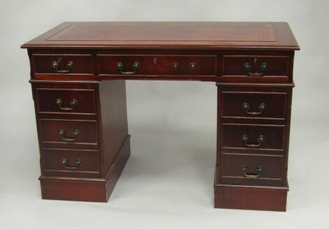 A mahogany twin pedestal desk