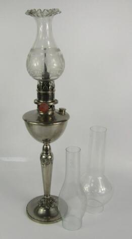 A French Titus white metal oil lamp