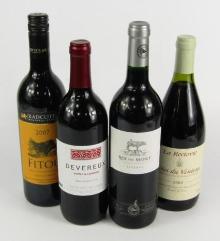 Four bottles of French red wine