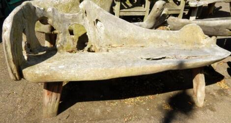 A two seater driftwood bench.