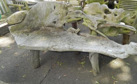 A two seater driftwood bench.