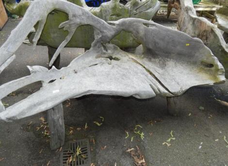 A two seater driftwood bench.