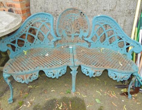 A Coalbrookdale style turquoise Romanesque style cast iron three seater garden bench