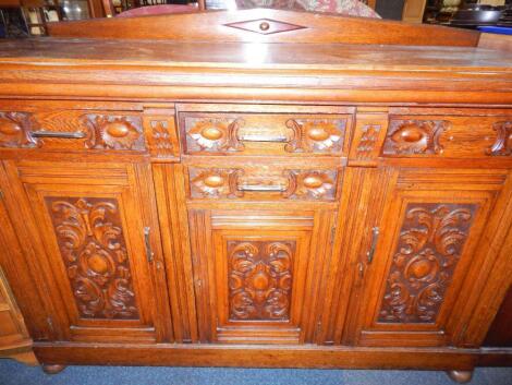 A Victorian oak sideboard