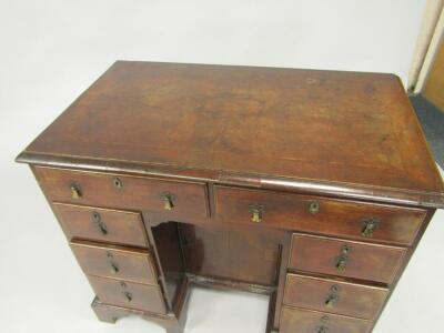 A George II walnut and cross banded kneehole desk - 2