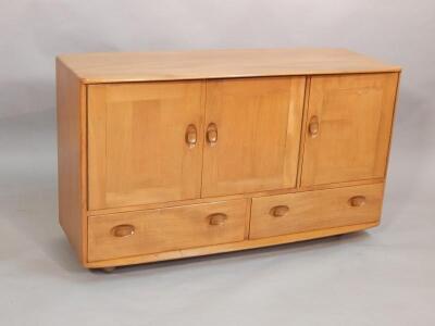 An Ercol light elm sideboard