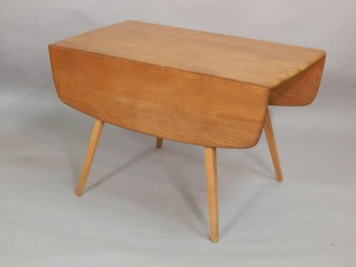 An Ercol light elm drop leaf table