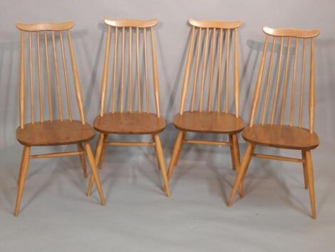 A set of four Ercol light elm and beech stickback kitchen chairs