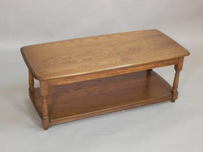 An Ercol elm two tier coffee table