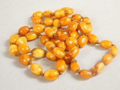 A quantity of polished amber beads