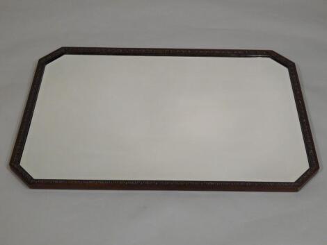 An Edwardian carved mahogany wall mirror