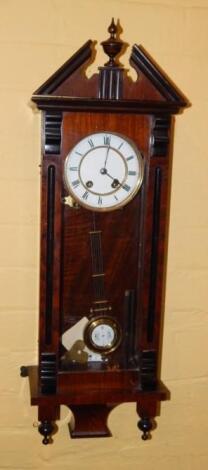 A late 19thC / early 20thC walnut and ebonised Vienna type wall clock