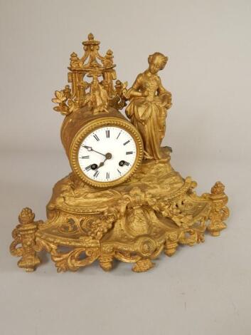 A late 19th/early 20thC French gilt metal figural mantel clock