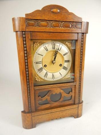 An early 20thC oak cased mantel clock