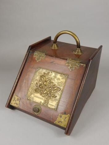 A late 19thC aesthetic style mahogany coal scuttle