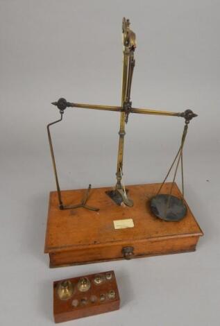 A late 19thC/early 20thC brass and mahogany balance or scale