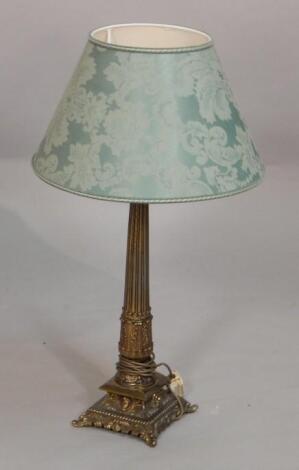 A gilt metal column table lamp