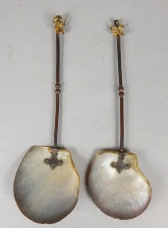 A pair of Continental bronzed metal spoons