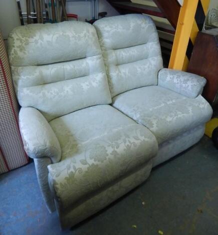 A modern double reclining two seat sofa