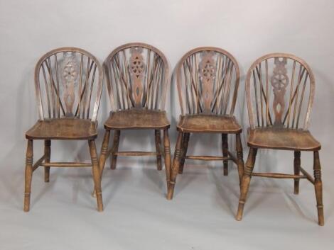 A set of four 20thC Windsor wheelback kitchen chairs