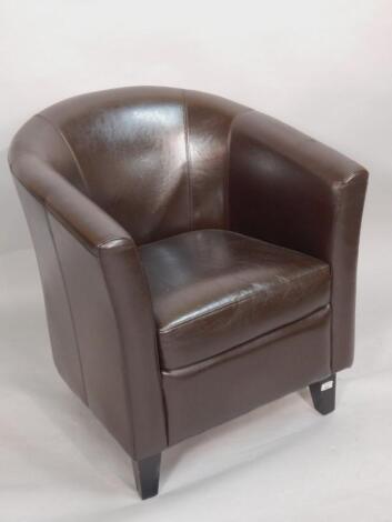 A modern brown leather upholstered tub chair