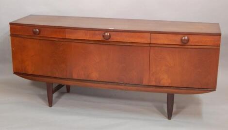 An Eon retro style teak bow fronted sideboard