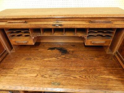 An early 20thC Harris Lebus oak roll top desk - 2