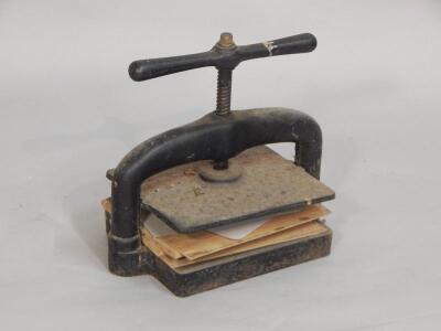 A cast iron book press